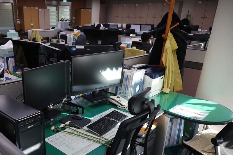 Empty desks and tears mark five colleagues killed in South Korean plane crash